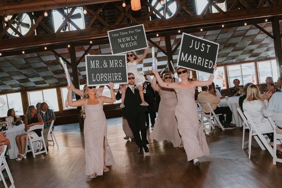 Wedding party celebrating a newlywed couple